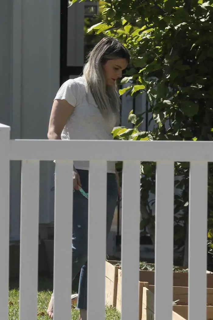 ali fedotowsky gardening on a sunny day at home in the garden 2