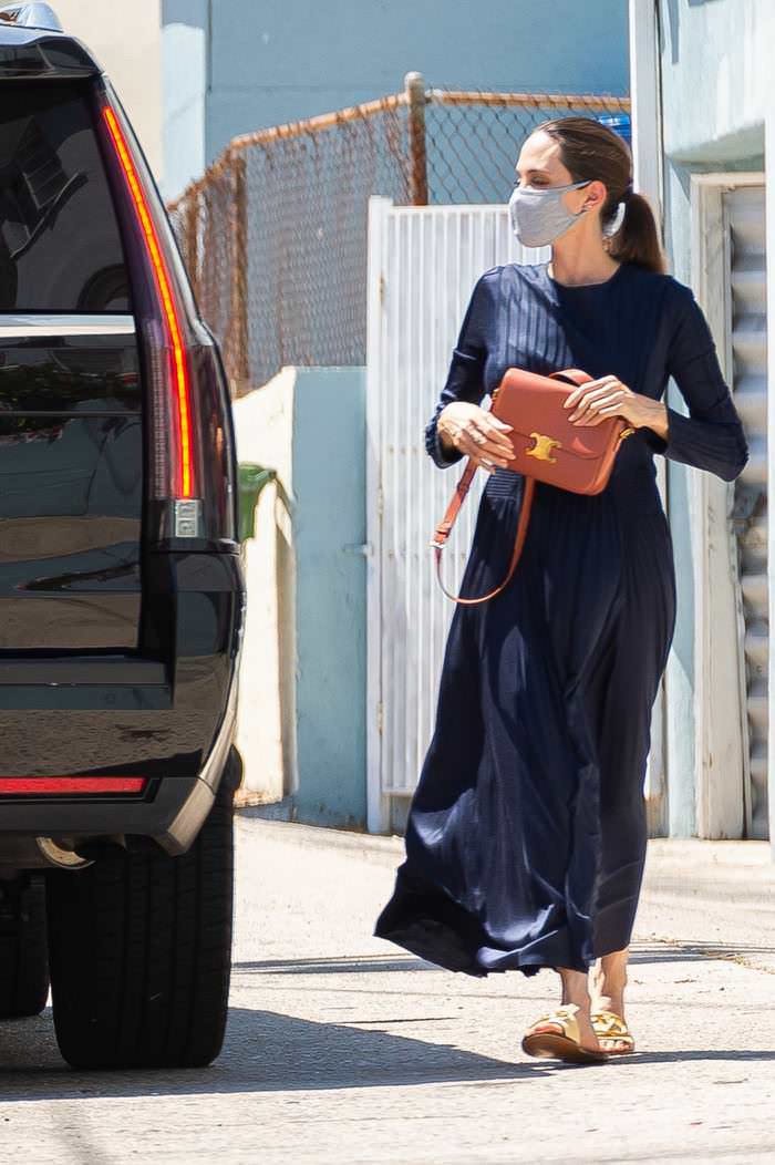 angelina jolie heads out to pick up supplies with son knox 4
