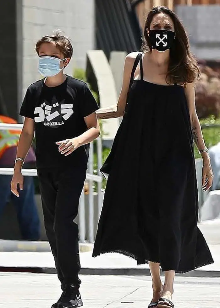 angelina jolie is wearing a face mask that raises funds for covid 19 efforts 1