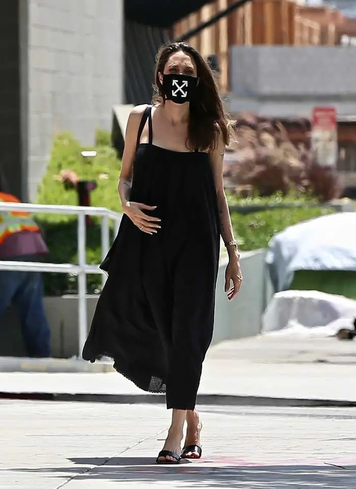 angelina jolie is wearing a face mask that raises funds for covid 19 efforts 4