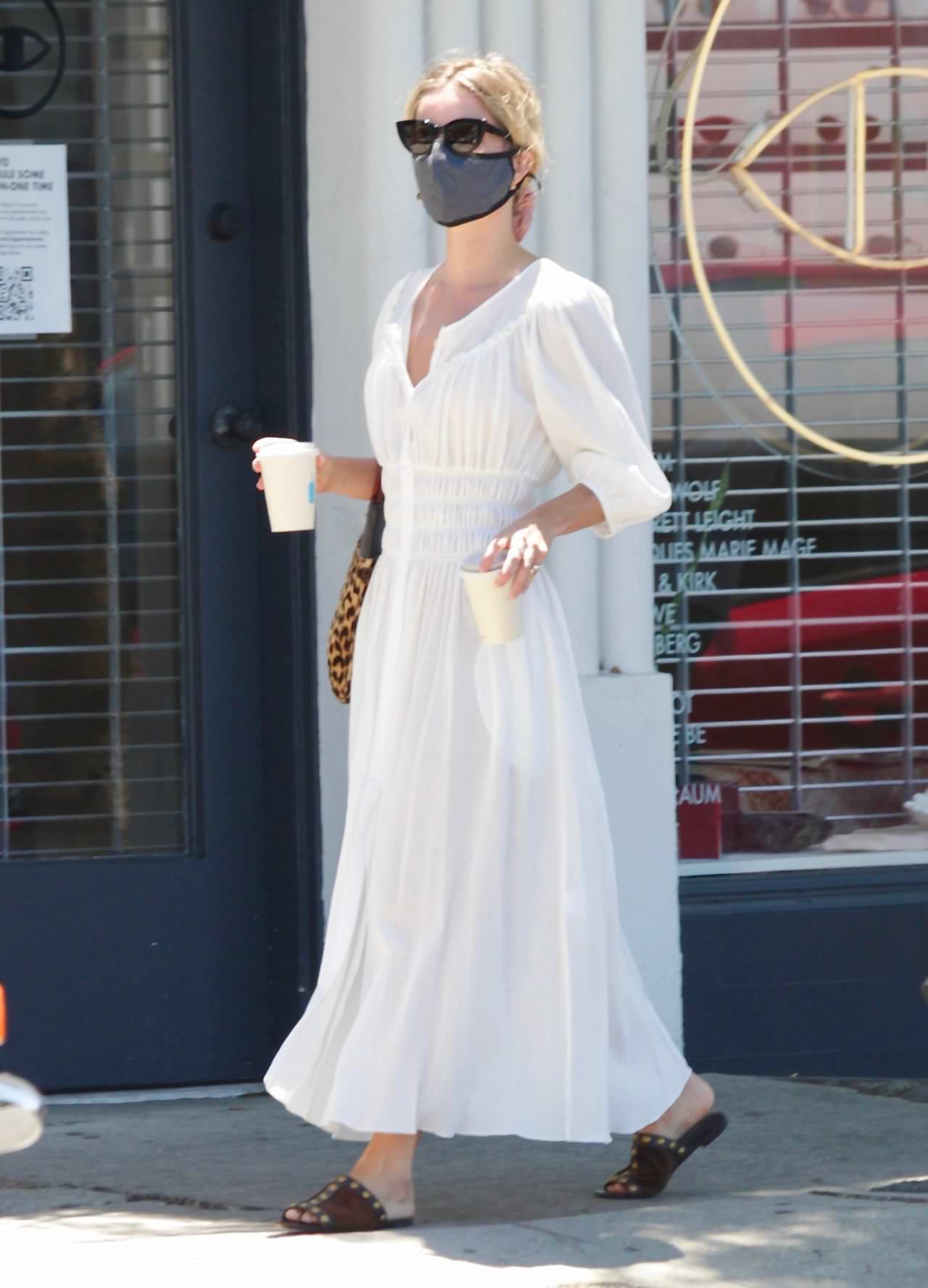 annabelle wallis grabs coffee to go while her bf waits in the car 2