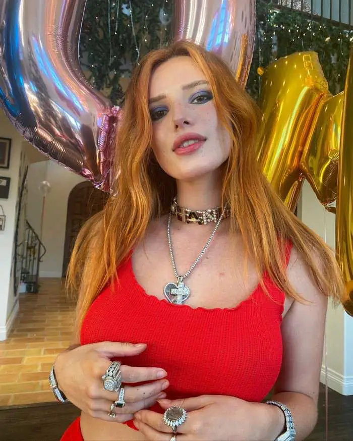 Bella Thorne in a Red Crop Top with Chunky Jewellery