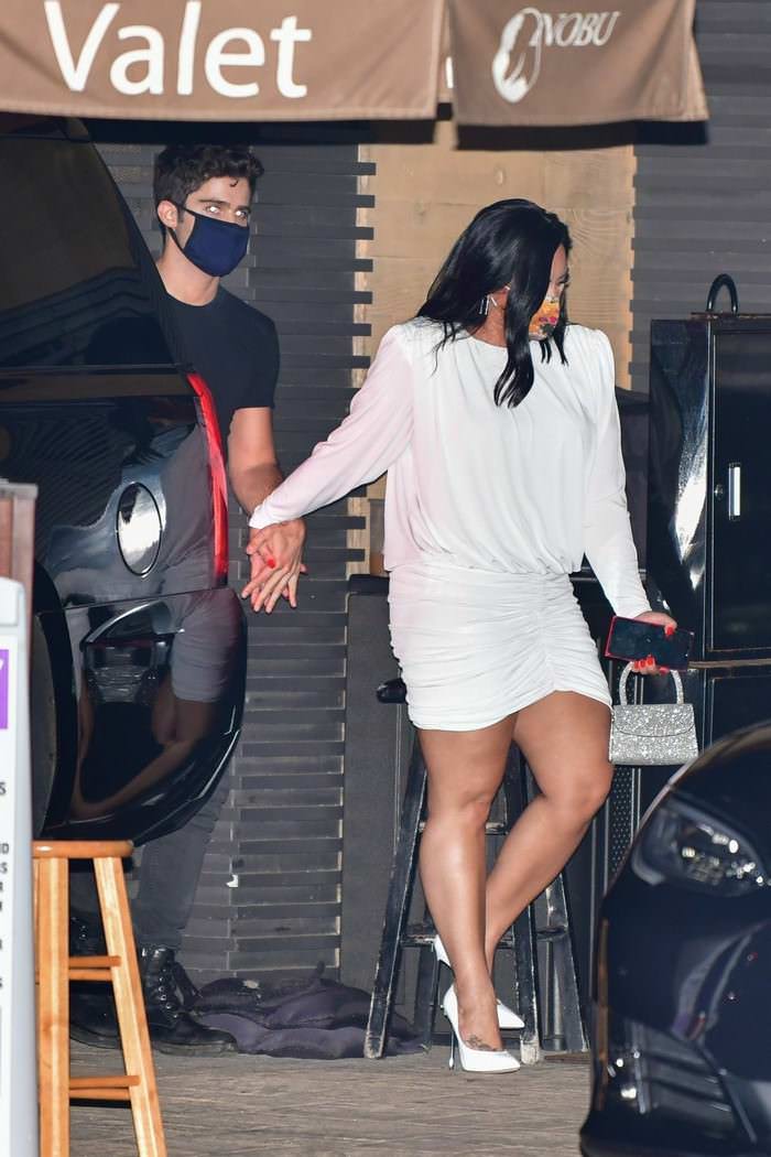 demi lovato in all white celebrate an engagement with her husband to be 4