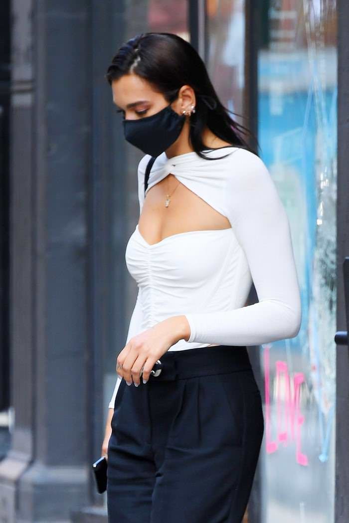 dua lipa in a chic white cut out bodysuit leaves a studio in ny 3