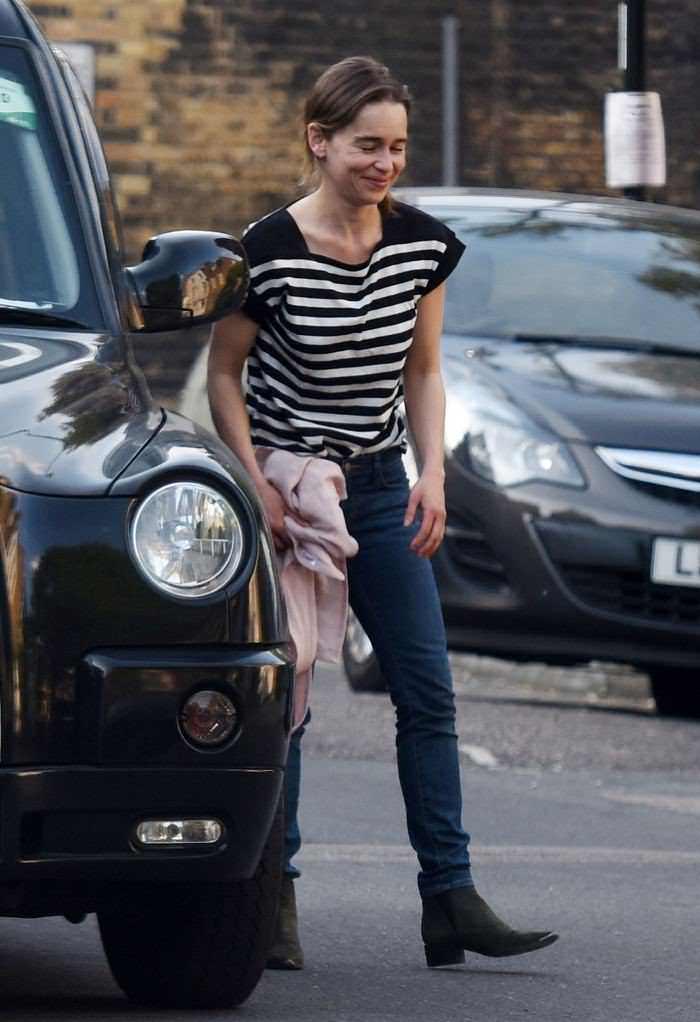 Emilia Clarke Cuts a Casual Figure in Black and White Striped T-Shirt