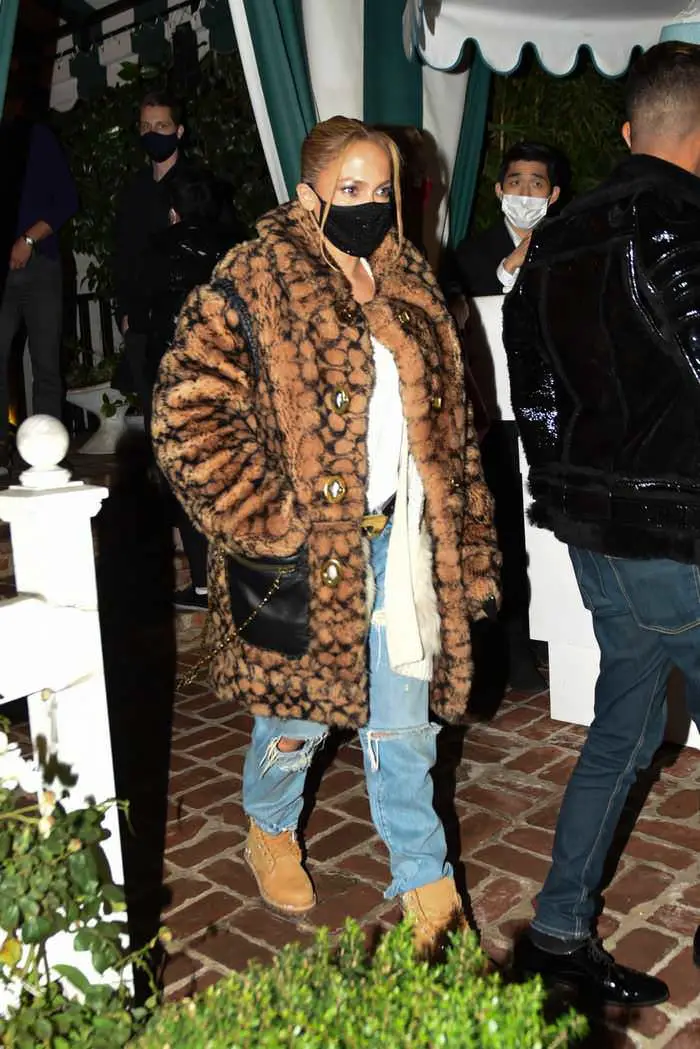 jennifer lopez in ripped jeans and a 900 coach coat for date night with a rod 2