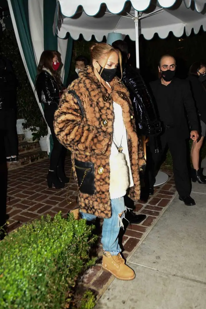 jennifer lopez in ripped jeans and a 900 coach coat for date night with a rod 3