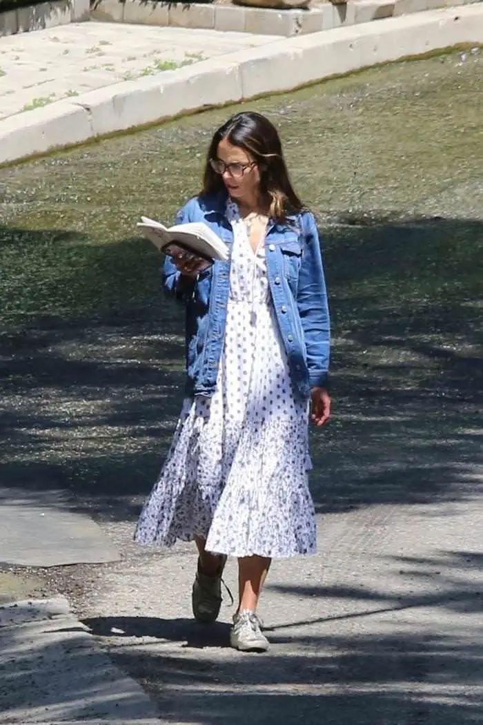 jordana brewster reads a book while walking in brentwood 1