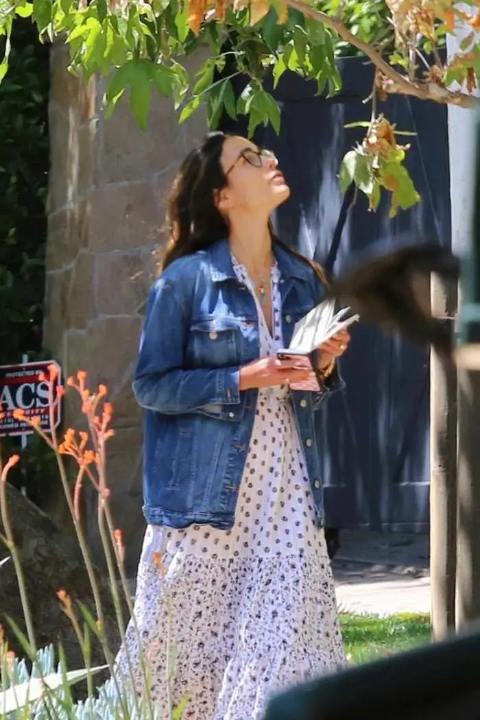 jordana brewster reads a book while walking in brentwood 2