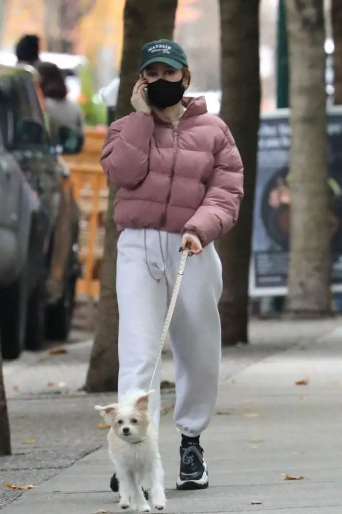 madelaine petsch walks with her dog during a break from filming riverdale 2