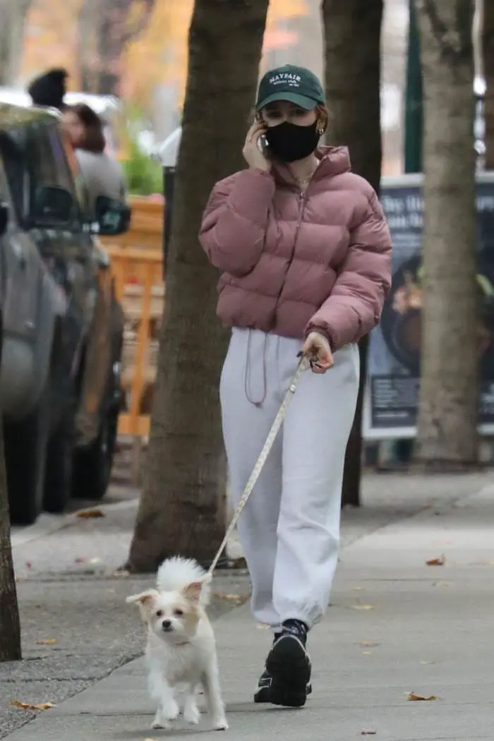 madelaine petsch walks with her dog during a break from filming riverdale 3