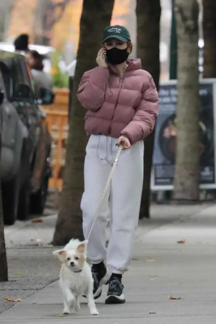 madelaine petsch walks with her dog during a break from filming riverdale 4