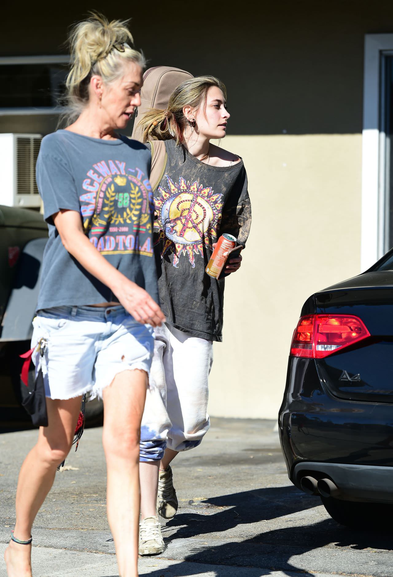 paris jackson in a peace sign t shirt as she smokes with friends 1