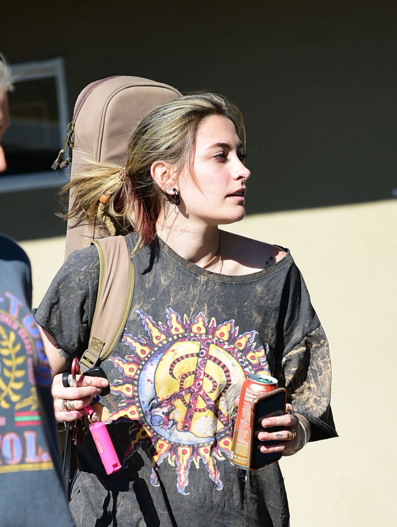 paris jackson in a peace sign t shirt as she smokes with friends 4