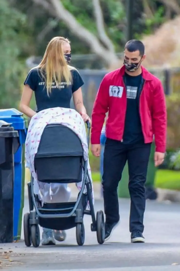 Sophie Turner And Joe Jonas Walk With Their Baby Girl Around Their