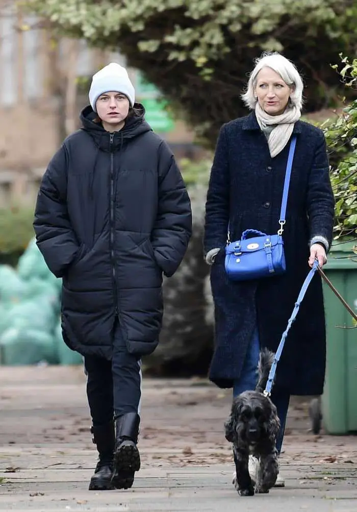 the crown s star emma corrin looks very casual in long jacket and knit cap 1