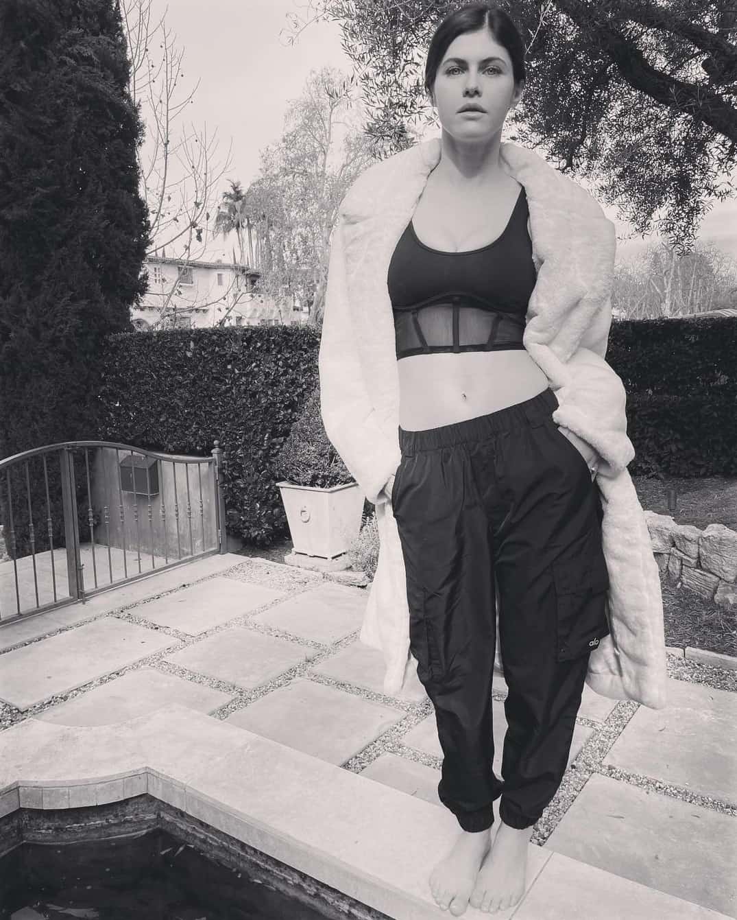 Alexandra Daddario Posing in a Chic “Alo Yoga” Outfit in her Backyard in LA