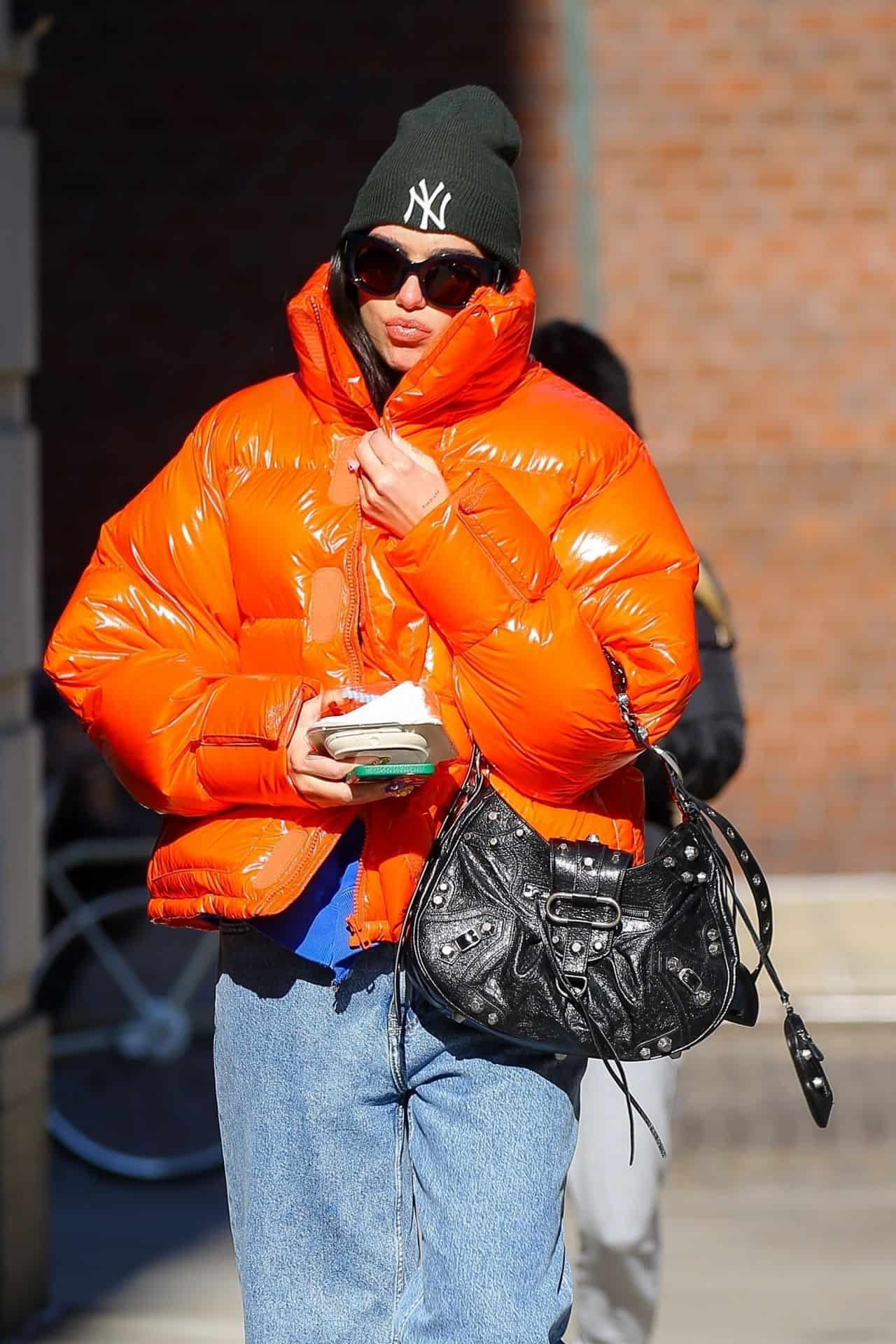 Dua Lipa Bundles Up in a Bright Orange Jacket as she Headed to the Gym