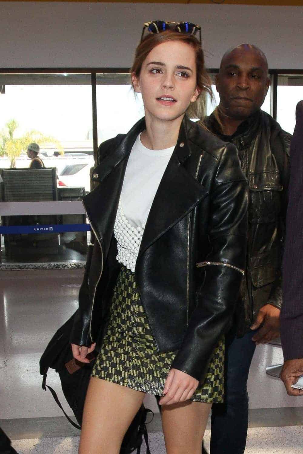 Emma Watson Wore a Green Mini Skirt and Edgy Biker Jacket at LAX Airport