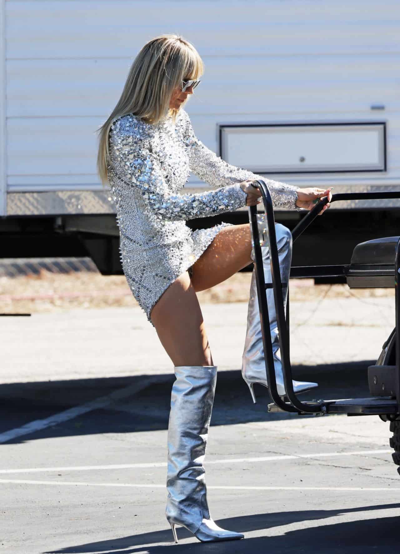 Heidi Klum Shows Off Her Legs in a Sparkly Silver Dress on the Set of GNTM