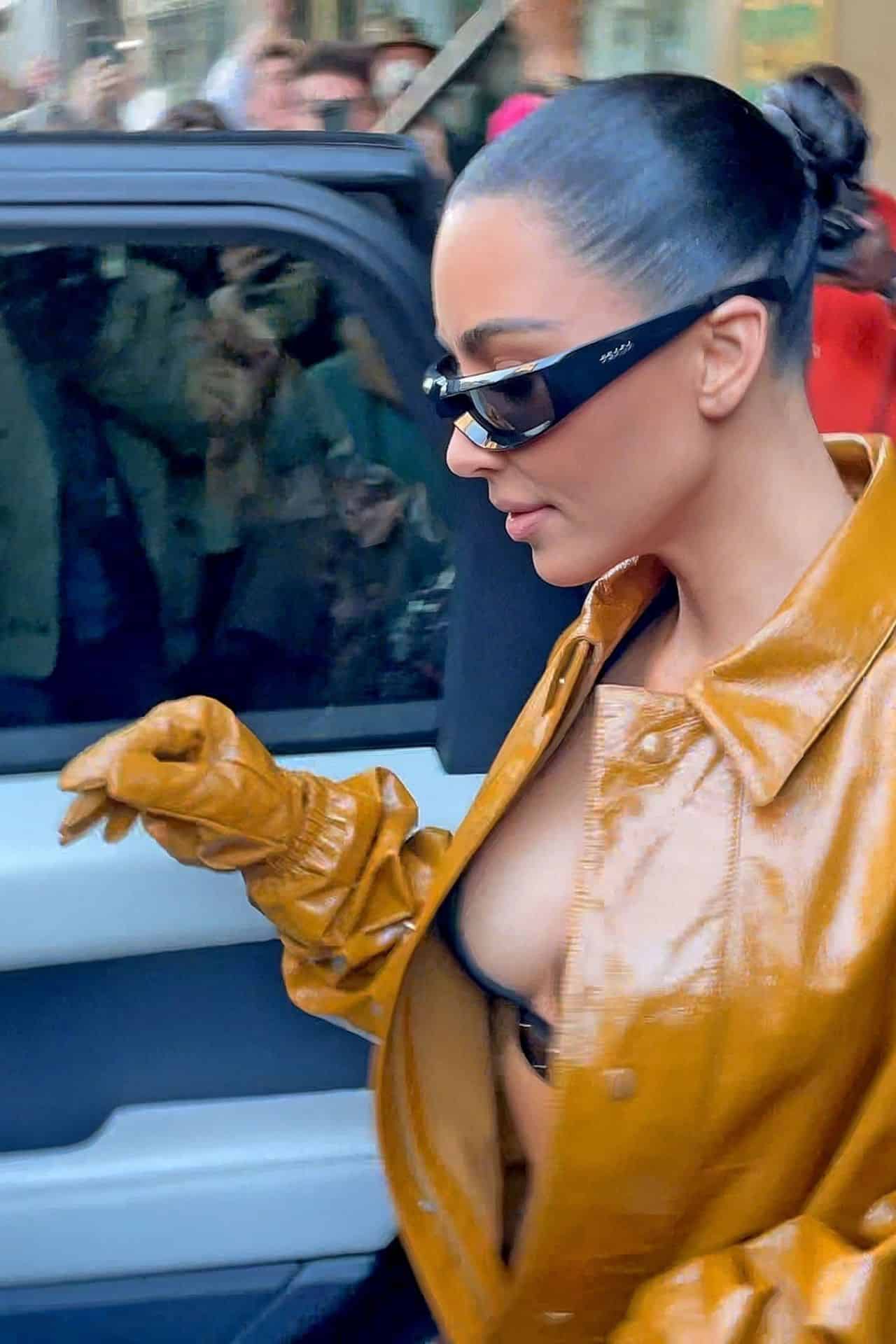 Kim Kardashian Shows Off her Bust in PVC Coveralls at Milan Fashion Week