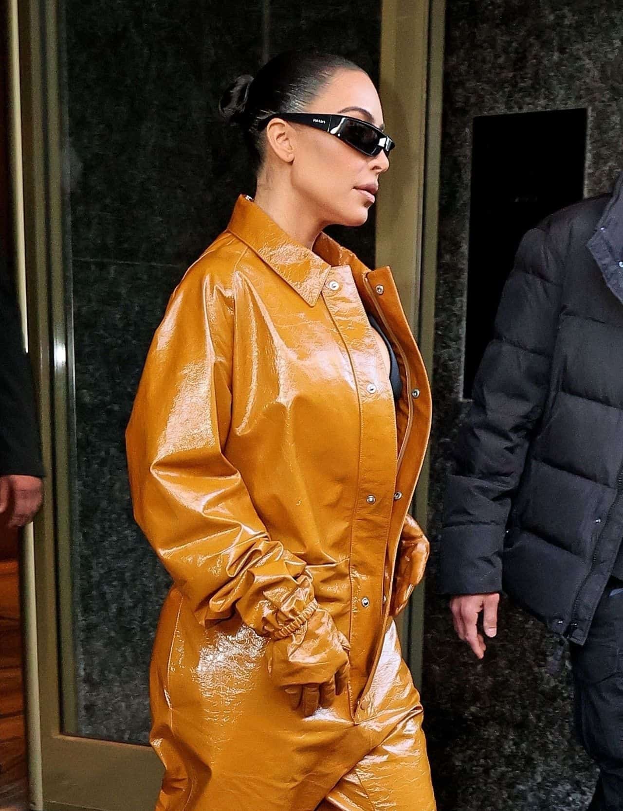 Kim Kardashian Shows Off her Bust in PVC Coveralls at Milan Fashion Week