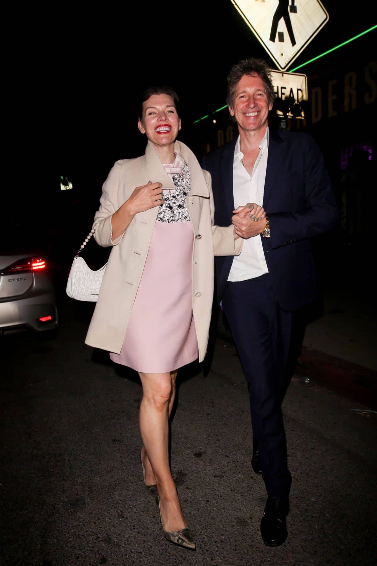 Milla Jovovich Stuns with her Glowing Smile and Pink Dress at Prada Event