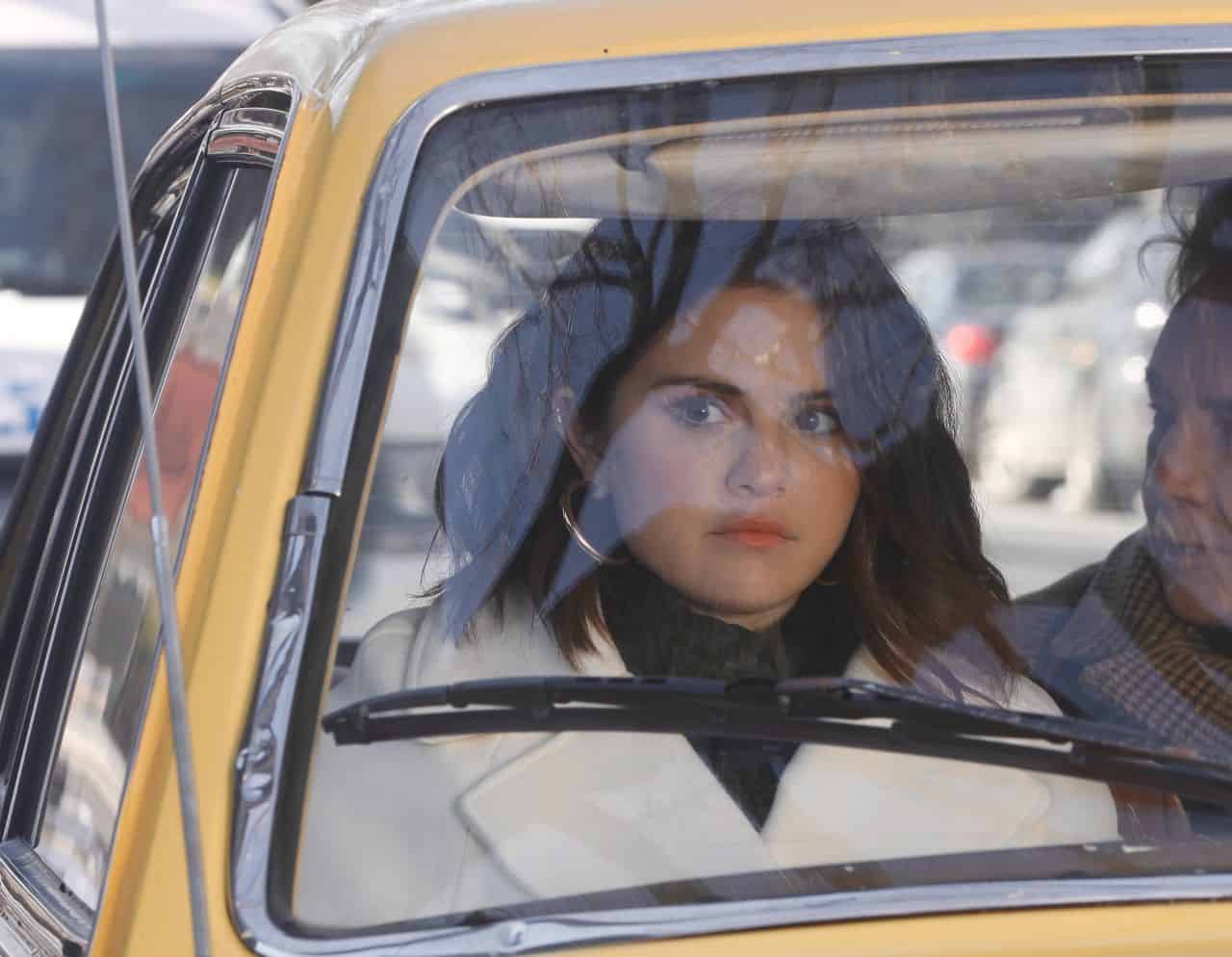 Selena Gomez Wore a White Coat During the Amusing Scene in the Car in OMITB