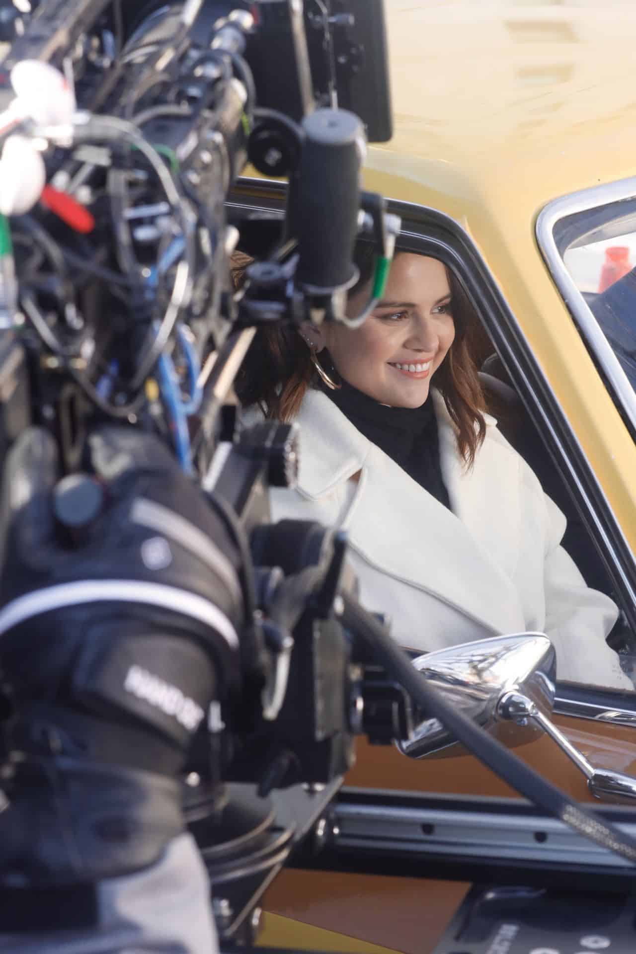 Selena Gomez Wore a White Coat During the Amusing Scene in the Car in OMITB