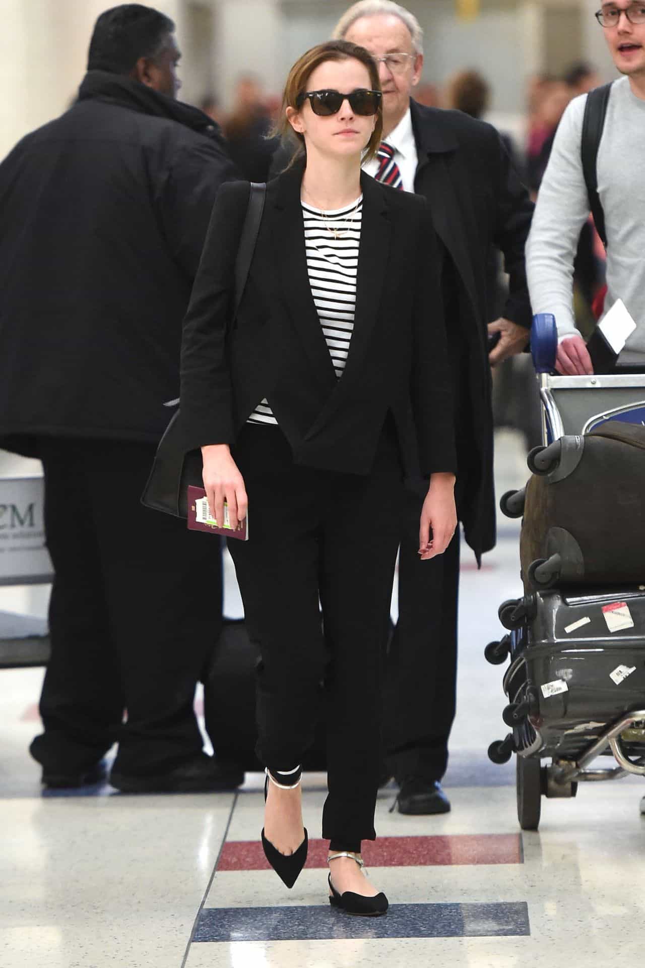Emma Watson Arrives with Style at JFK Airport in a Striped Top and Blazer