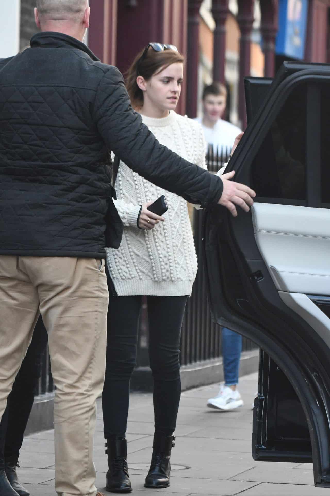 Emma Watson Looks Fantastic in a White Knitted Sweater and Black Jeans