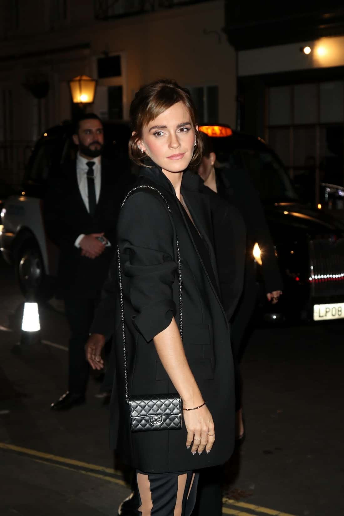 Emma Watson Poses on the Street Before the Charles Finch X Chanel Dinner