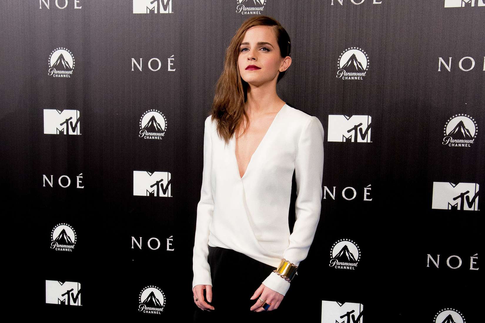 Emma Watson Turns Up the Heat in a V-neck Blouse at the "Noah" Premiere in Madrid