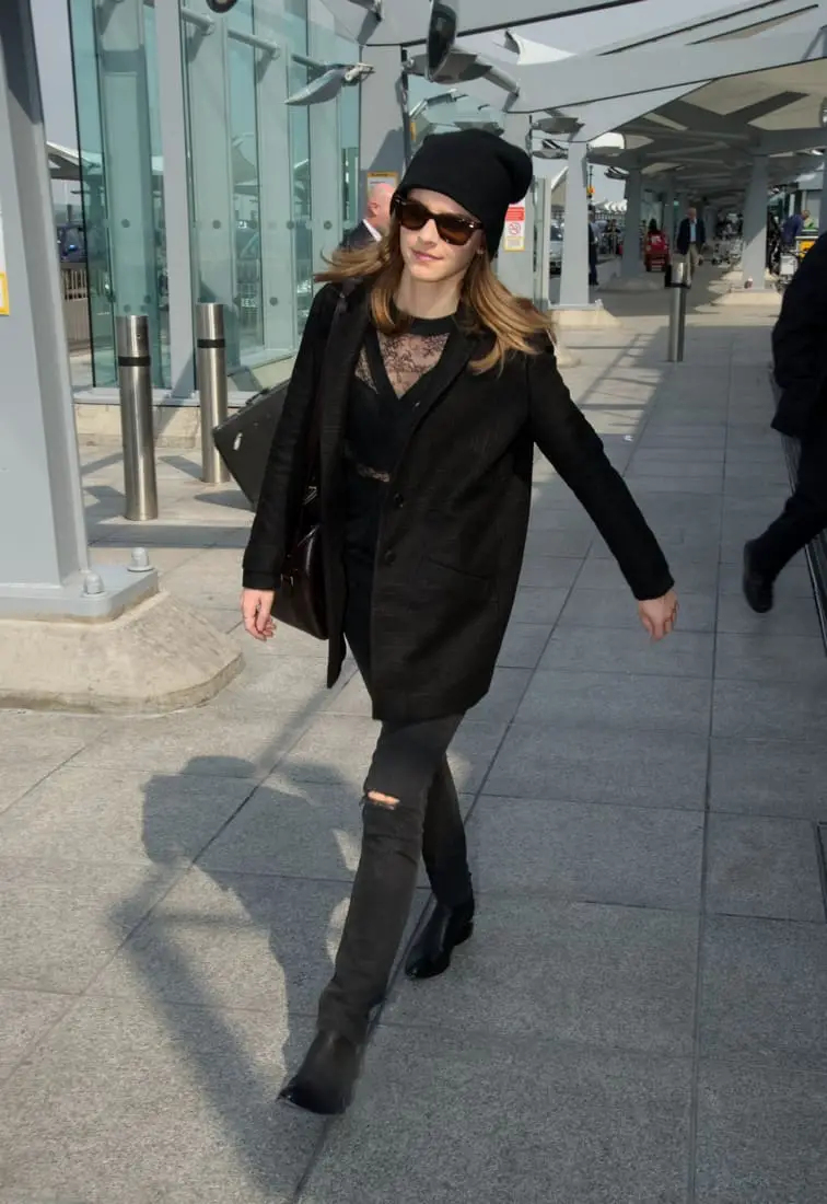 Emma Watson Looks Chic in an All-Black Outfit at Heathrow Airport in London