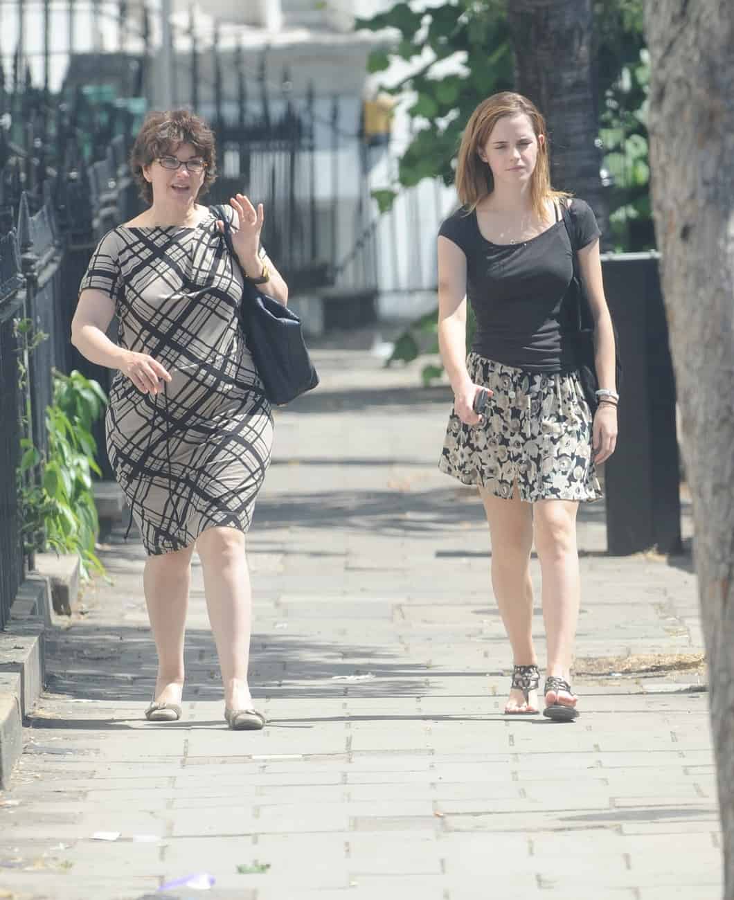 Emma Watson Radiates Beauty in a Black T-shirt and Mini Skirt in London