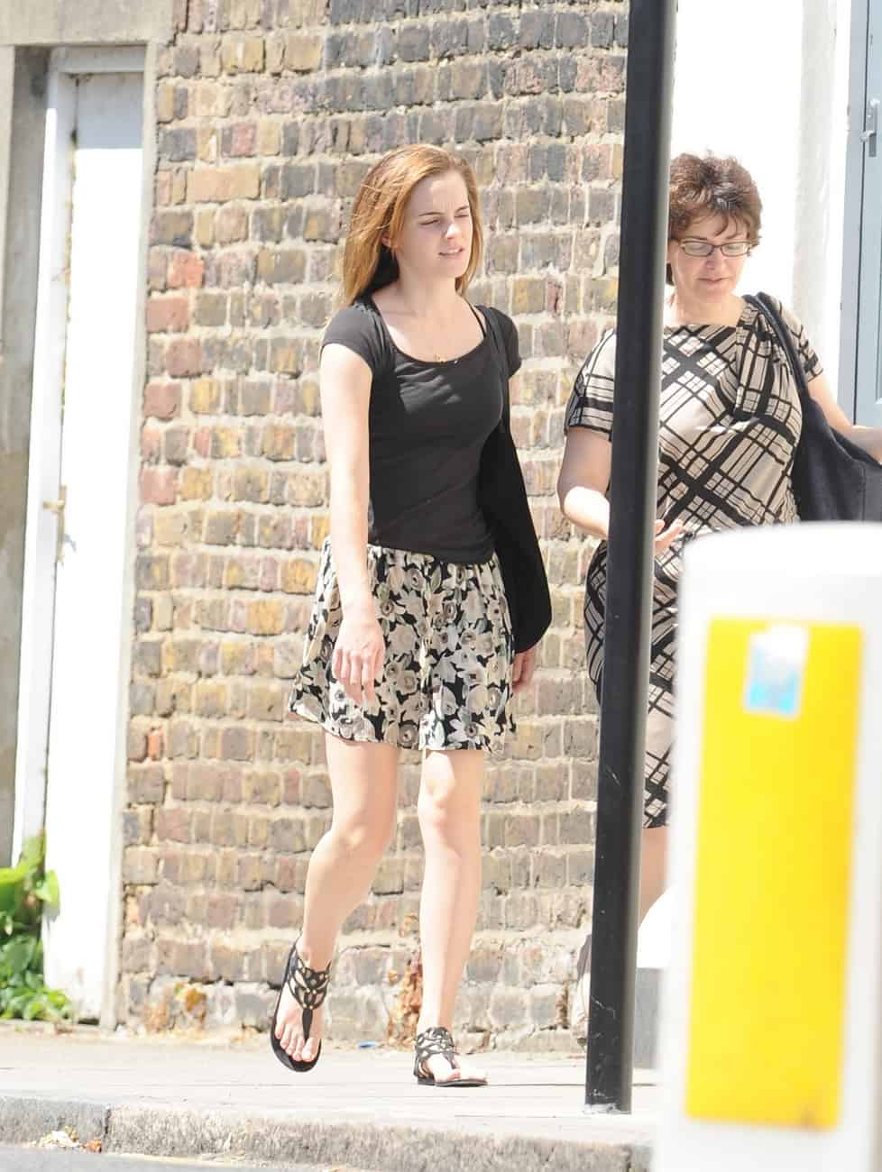 Emma Watson Radiates Beauty in a Black T-shirt and Mini Skirt in London
