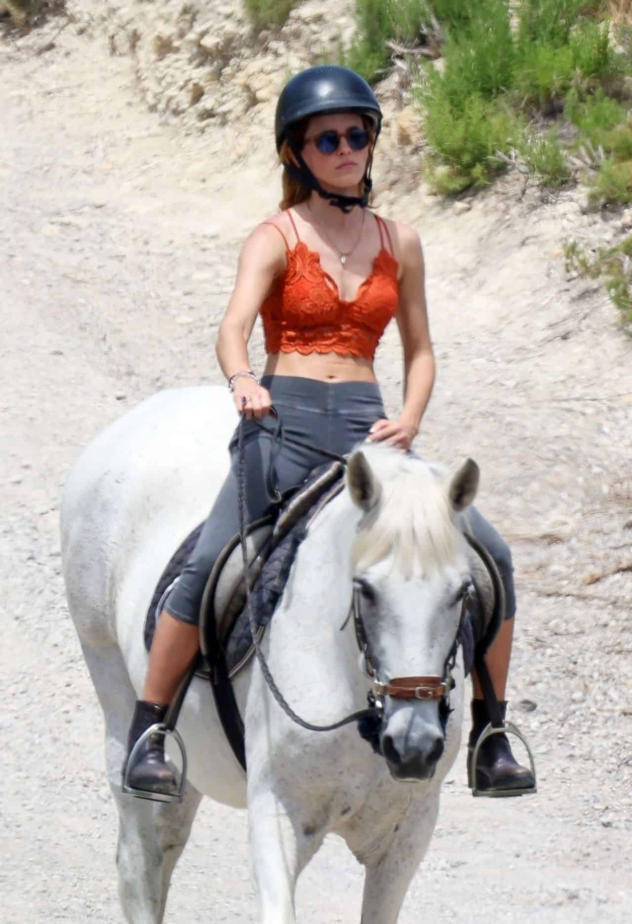 Emma Watson Wore a Lace Bralette as She was on a Horseback Ride in Ibiza