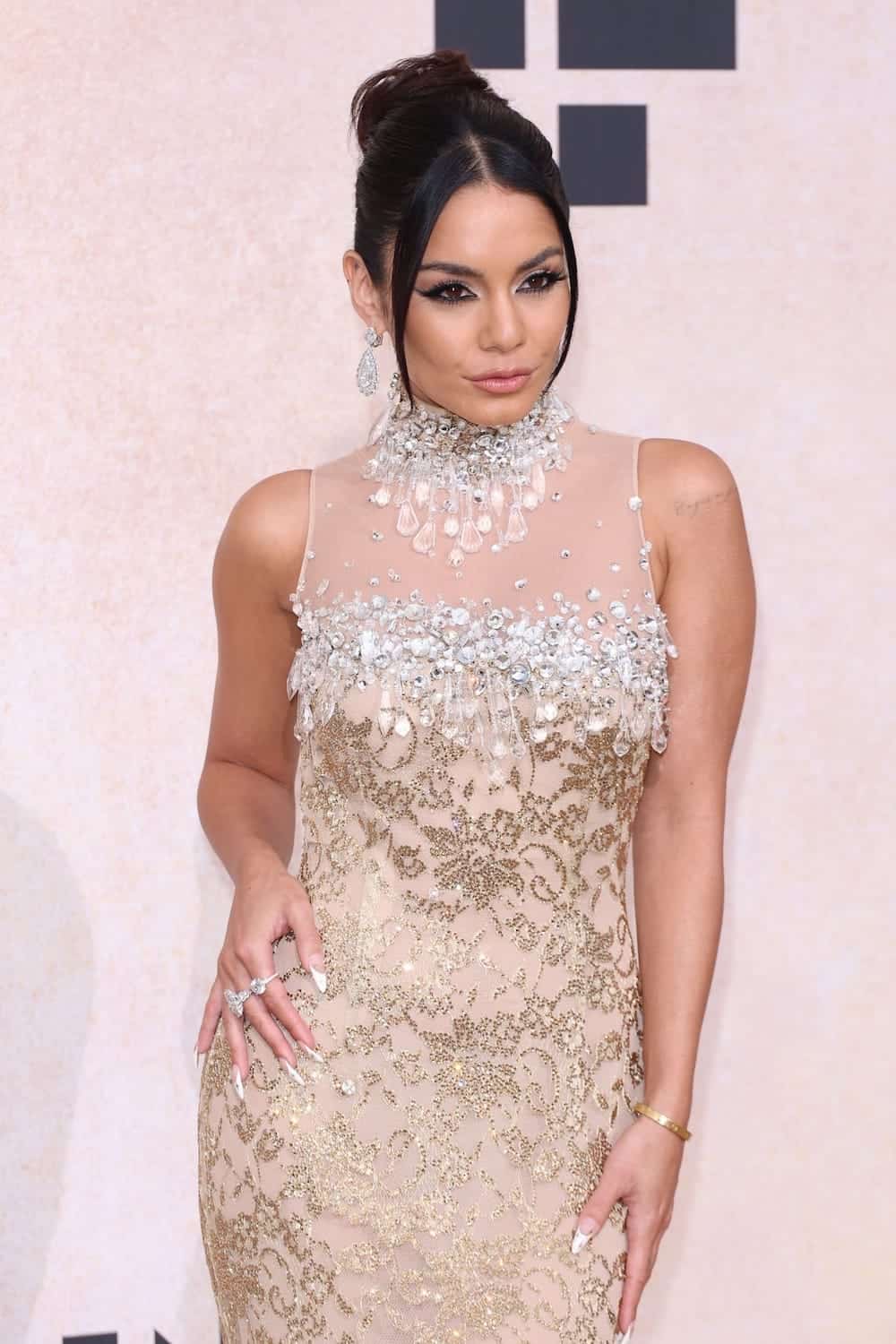 vanessa hudgens dazzles in a gold dress at the cannes 2022 amfar gala 15
