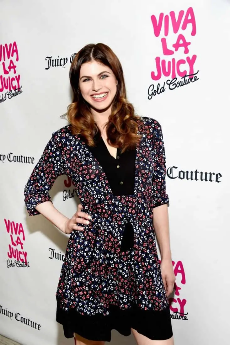Alexandra Daddario Poses at the Viva La Juicy Gold Couture Launch Event