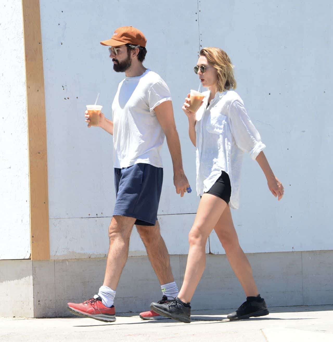 Elizabeth Olsen Wears Black Yoga Shorts During a Casual Walk with Husband