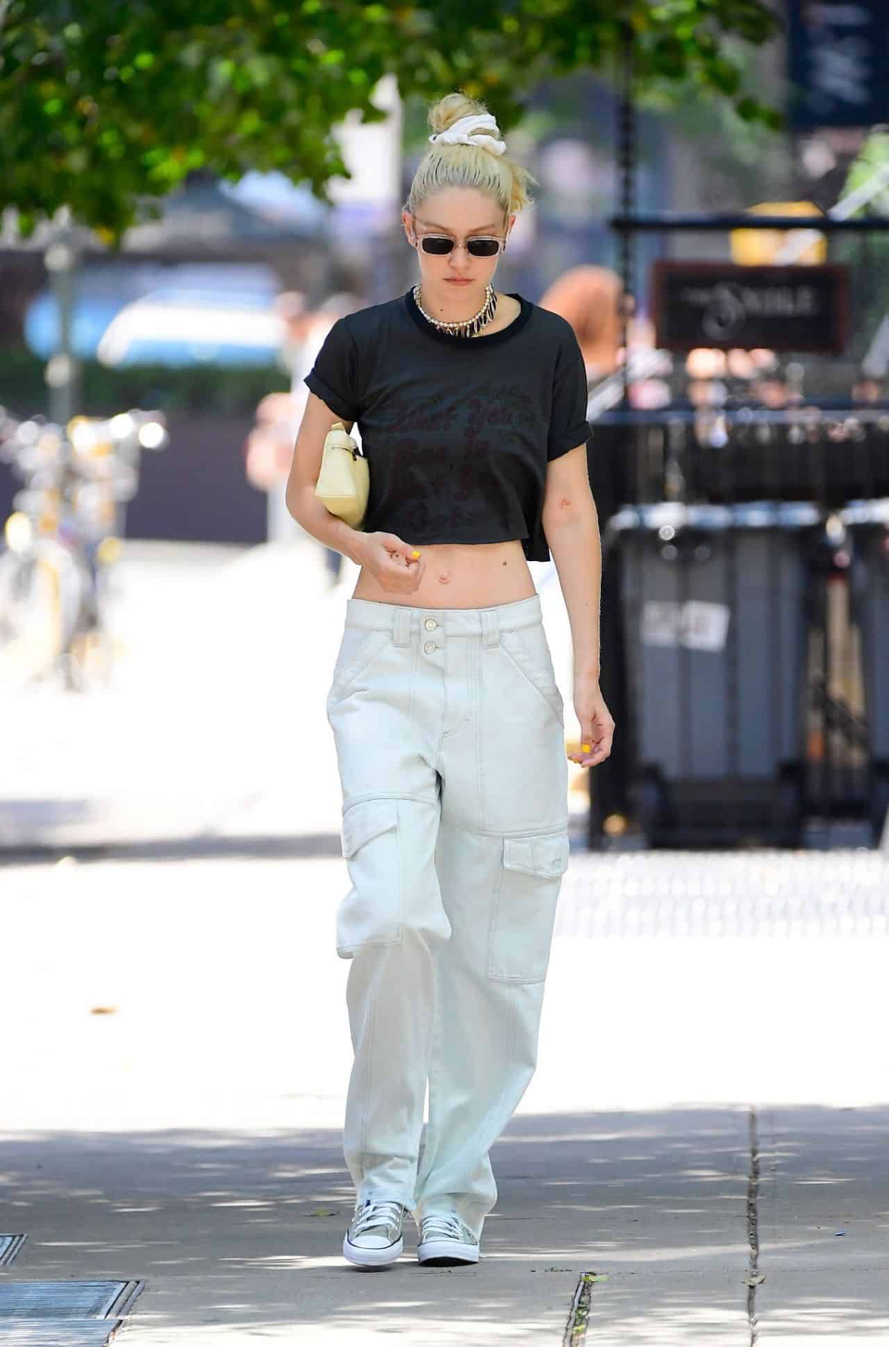 Gigi Hadid Walks Through New York in a Black Crop Top and Cargo White Pants