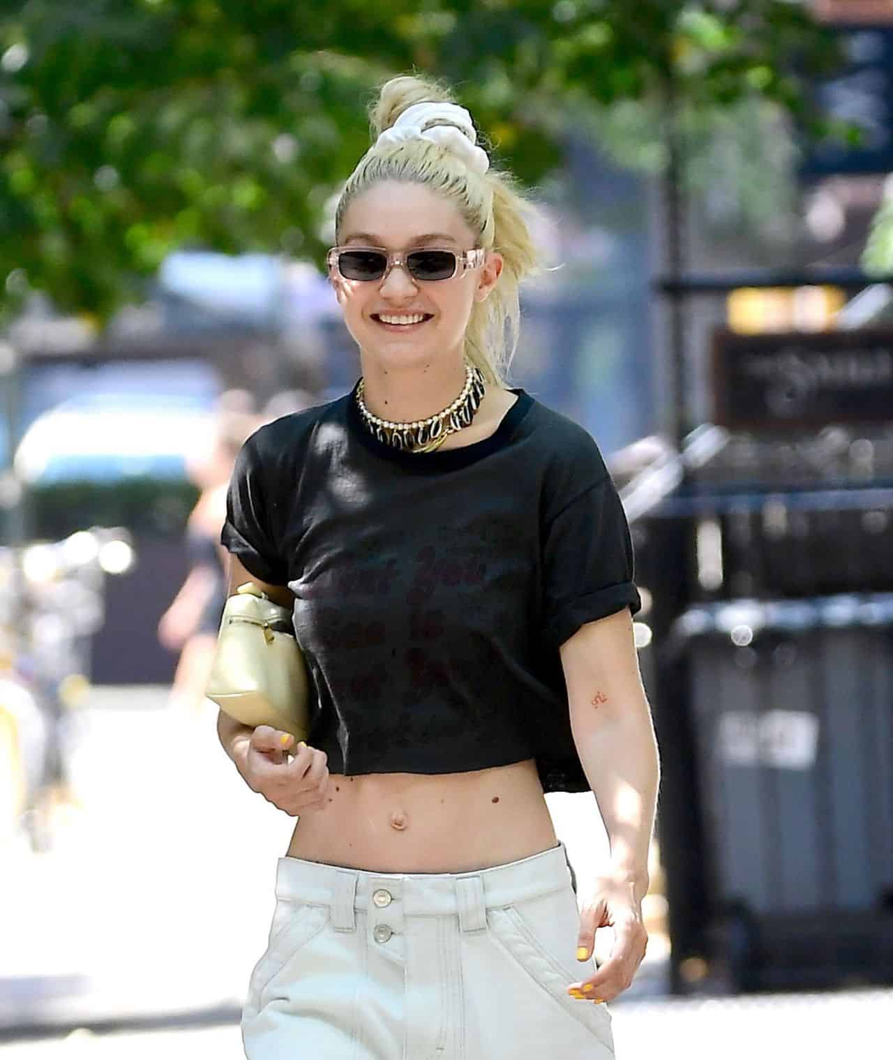 Gigi Hadid Walks Through New York in a Black Crop Top and Cargo White Pants