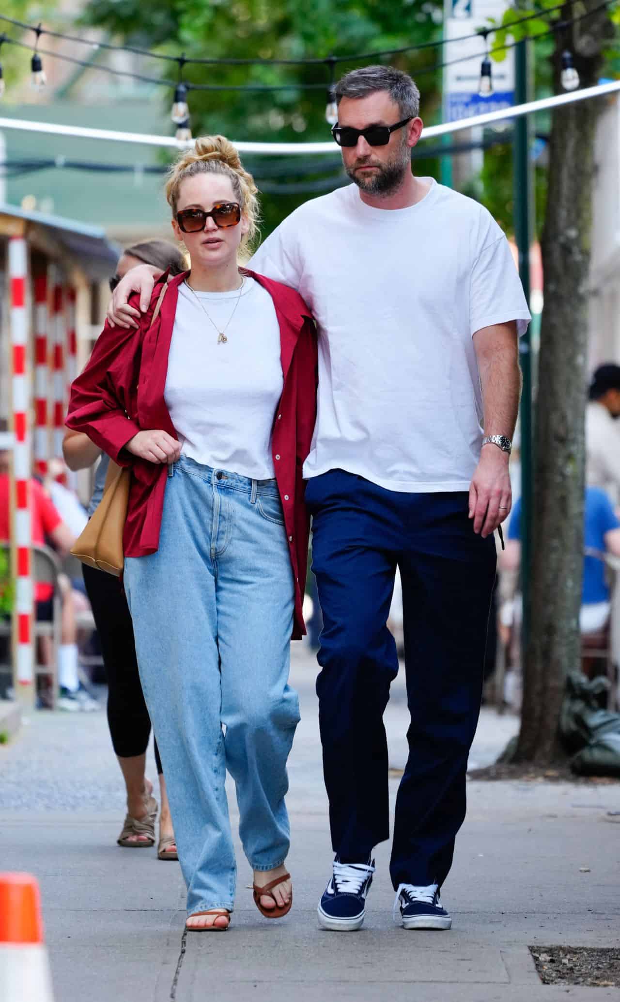 Jennifer Lawrence Wears Baggy Low-Rise Mom Jeans During a Romantic Walk