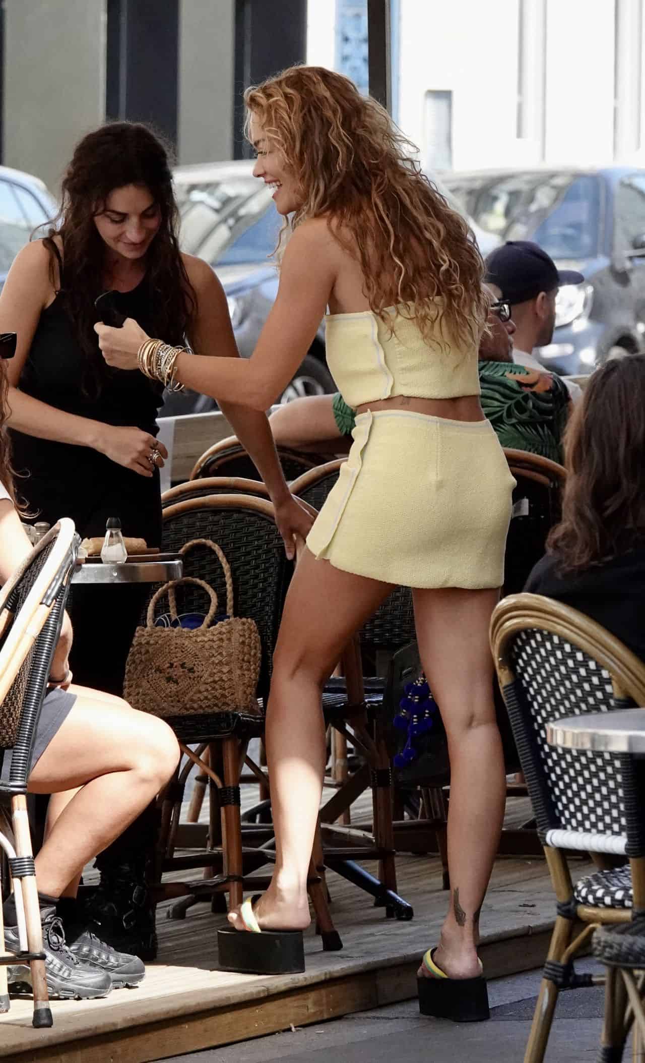 Rita Ora Radiates Beauty in a Chic Yellow Crop Top and Mini Skirt in Paris