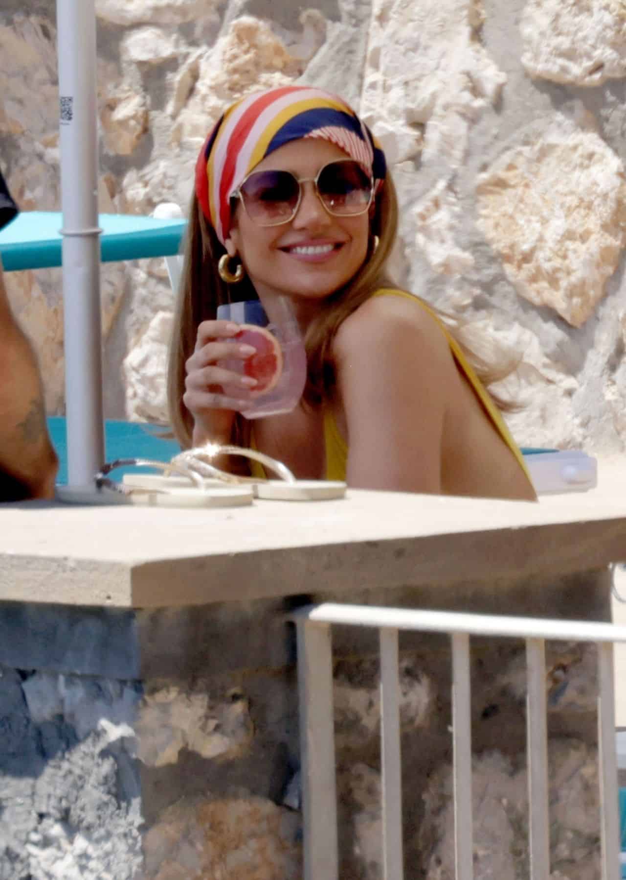 Jennifer Lopez Wore a Showy Yellow Swimsuit During a Photoshoot in Capri