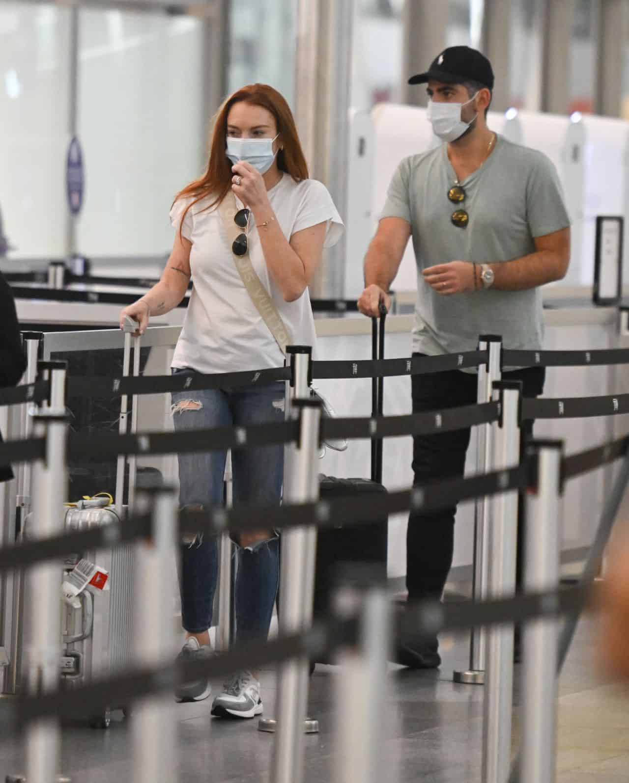Lindsay Lohan Rocks a Laidback Outfit with her Husband at JFK Airport