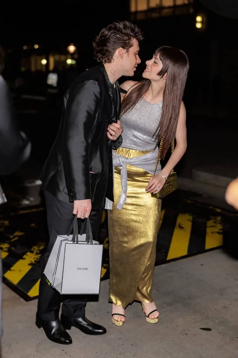 Nicola Peltz and Brooklyn Beckham kissing at the Tom Ford Show During the 2022 NYFW