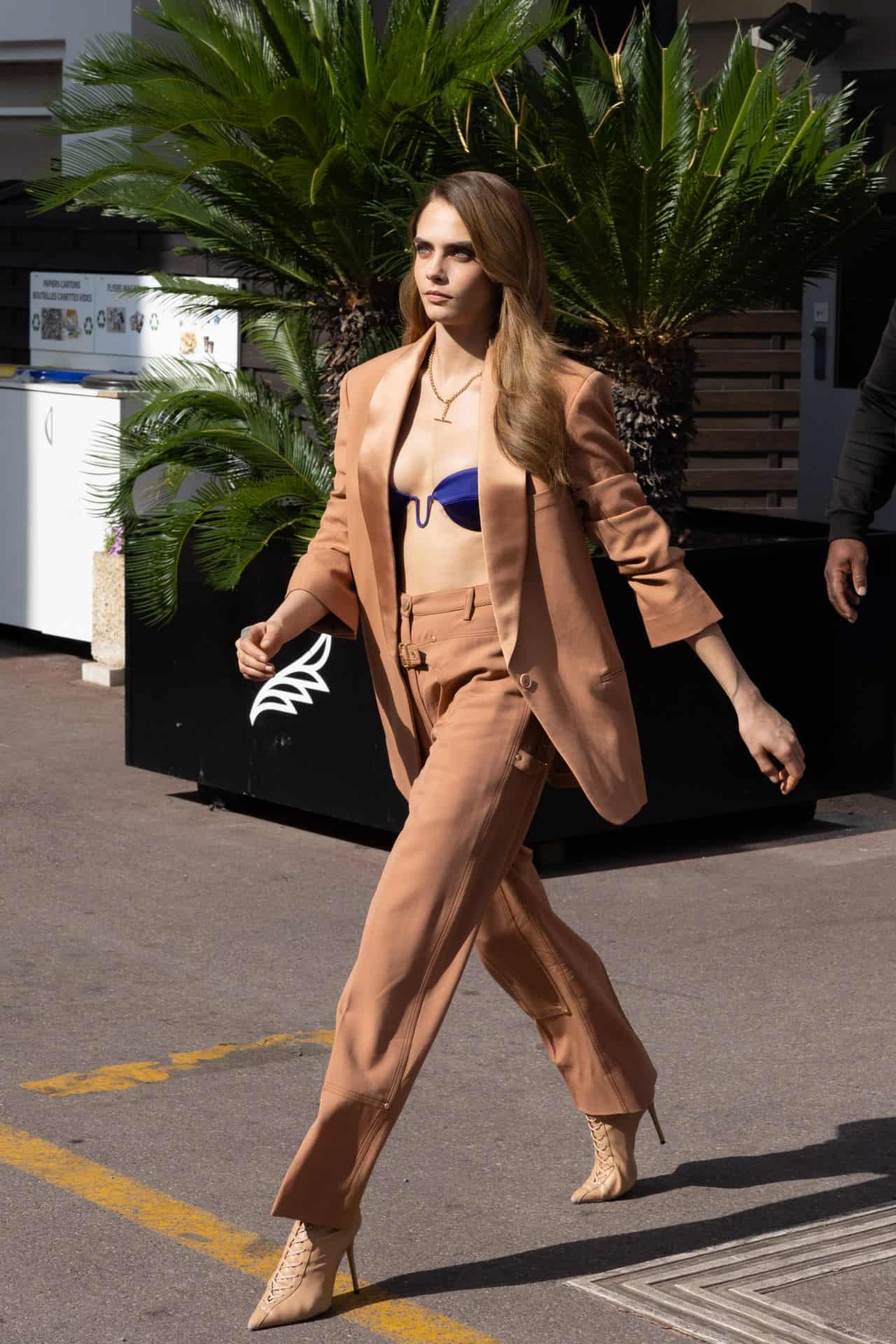 Cara Delevingne Flashes her Satin Bra Top while Leaving her Hotel in Cannes