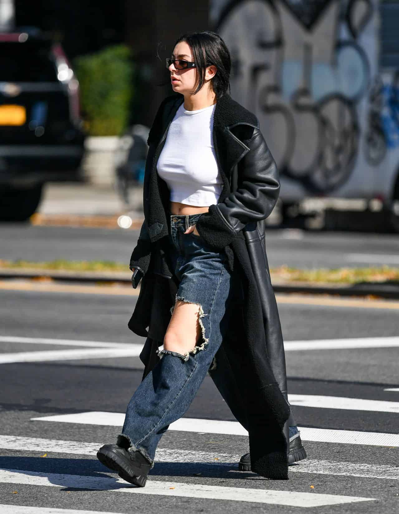 Charli XCX Strolls in Ripped Blue Jeans and a Crop Top Without a Bra in NY