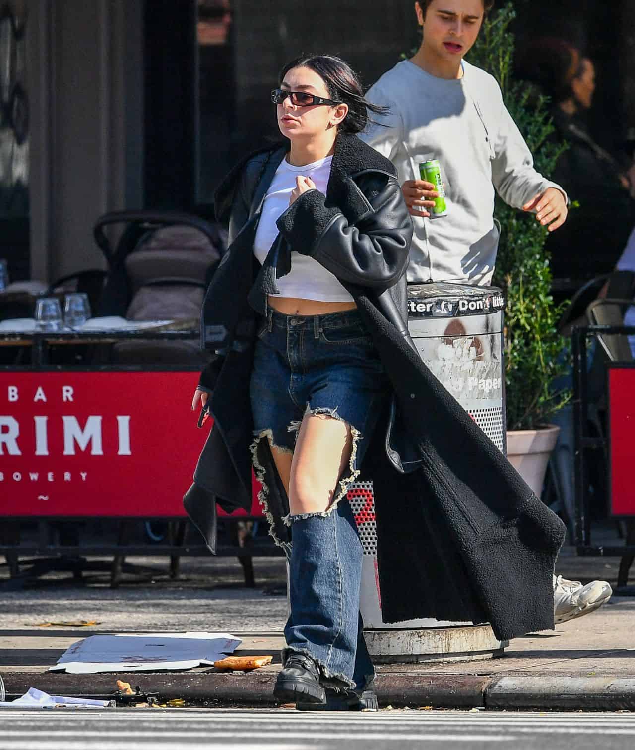 Charli XCX Strolls in Ripped Blue Jeans and a Crop Top Without a Bra in NY